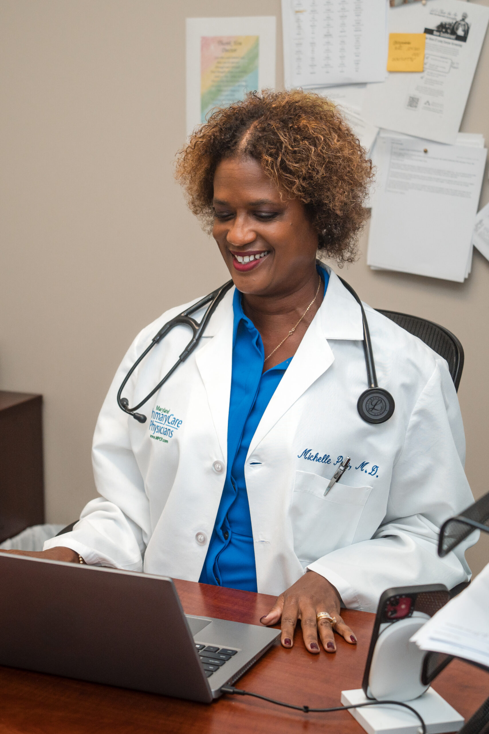 MPCP's Dr. Carter works on a computer