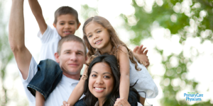 A family enjoying the outdoors safely on a sunny afternoon.